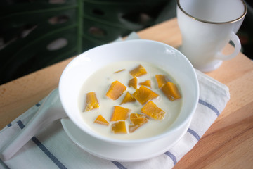 Thai dessert: Pumpkin in sweet coconut milk,  Coconut Milk Stewed Pumpkin bowl. (Buak Phak Tong)