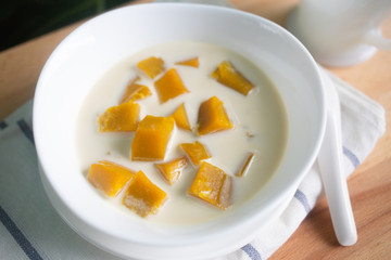 Thai dessert: Pumpkin in sweet coconut milk,  Coconut Milk Stewed Pumpkin bowl. (Buak Phak Tong)
