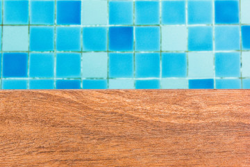 Swimming pool with wood panel.