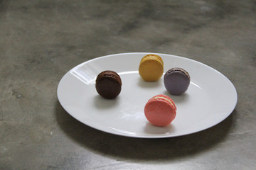 Macaron is a sweet meringue-based confection made with egg white, icing sugar, granulated sugar, almond powder or ground almond, and food coloring.