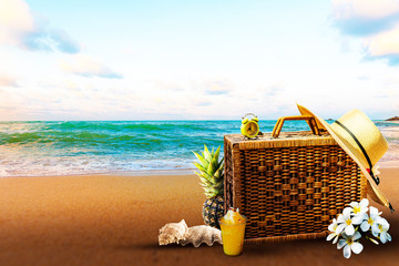  Travel bags and hats that are placed by the beach