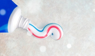 Tube of toothpaste close up on  background