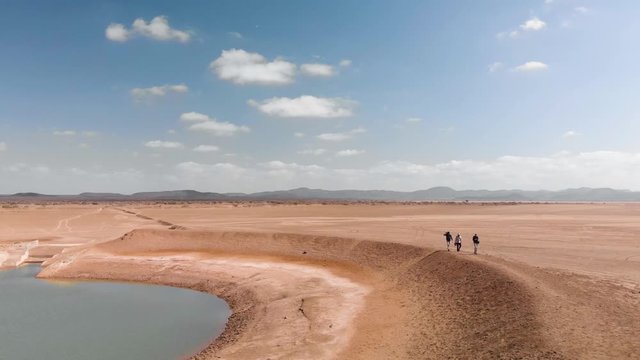 Aerial Over Film Crew At Oasis In Djibouti Desert, Africa. 4K Footage