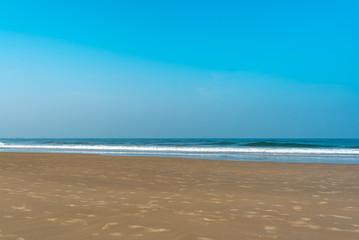 Fototapeta na wymiar Scenic view of clean and empty beach in colva, goa, india.