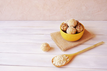 energy balls in a bowl of oatmeal, seeds, flaxseed