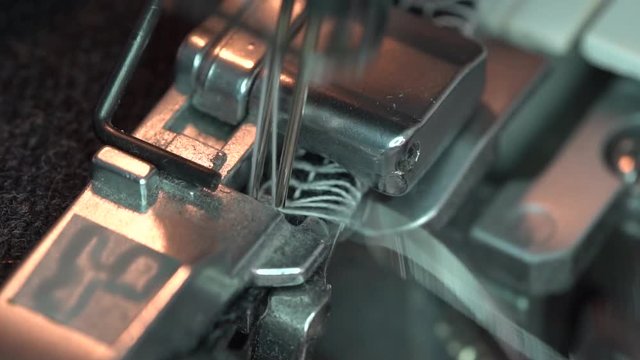 A Serger or Overlocking Sewing Machine. Presser foot close up