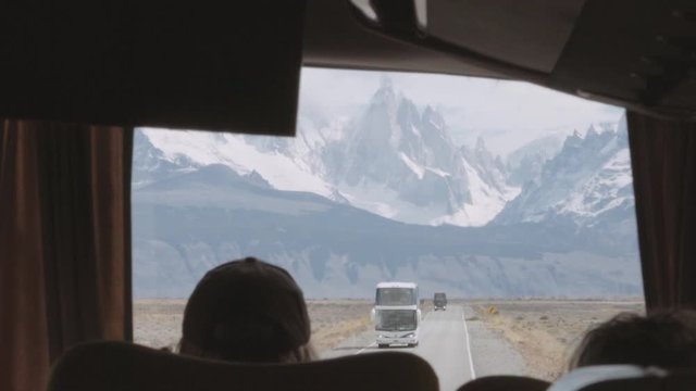 Bus traveling on the Patagonia steppe, view from the window of the Patagonian mountains, Fitz roy peaks. 4k