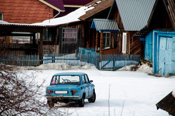Blue car stands near the manor