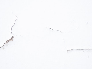 White wall crack texture background.