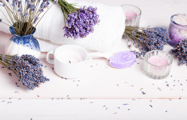 Obraz na płótnie Canvas Spa massage setting, lavender product, salt, candles, soap on white background