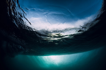 Breaking wave in underwater. Ocean in underwater