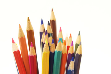 Colored pencils on white background