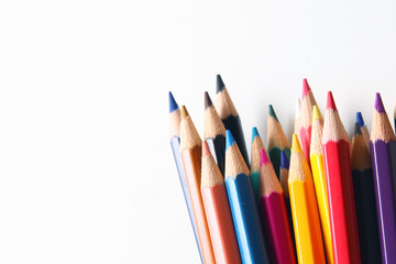 Colored pencils on white background