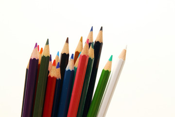 Colored pencils on white background
