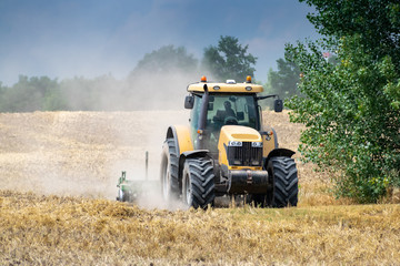 Tractor cultivating the field