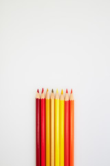Red and Yellow Color pencils  on white
