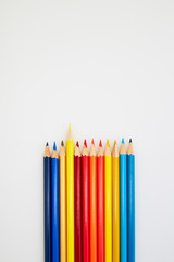 Colorful wooden pencils for drawing on white