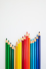 Colorful wooden pencils for drawing on white