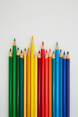Colorful wooden pencils for drawing on white