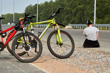 Happy girl with a bike on the track.