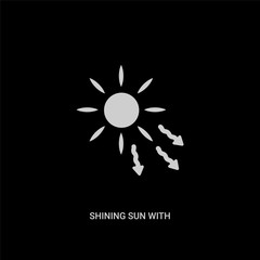 Fototapeta premium white shining sun with rays vector icon on black background. modern flat shining sun with rays from nature concept vector sign symbol can be use for web, mobile and logo.