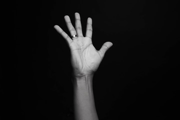 Hand with a ring and dark background. Luis's Hand