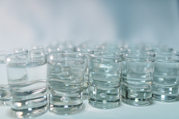 Close-up shots of a luxurious transparent tequila in a bar on a white background