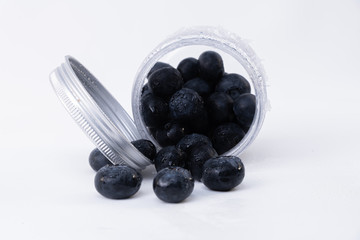 A boat full of fresh and delicious blueberries - Cold and sweet isolated blueberries on a white background
