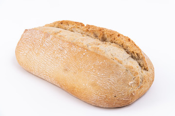 Loaf of a delicious bread isolated on white. Close up