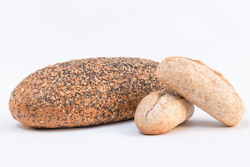 Two different loaf of multi grain bread on a white background