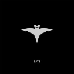 white bats vector icon on black background. modern flat bats from halloween concept vector sign symbol can be use for web, mobile and logo.