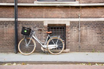 Fototapeta na wymiar View of an old characteristic house front and parked biked in the center of Den Bosch, The Netherlands.