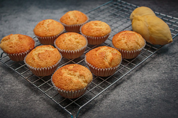 Homemade durian cupcakes on rock table.