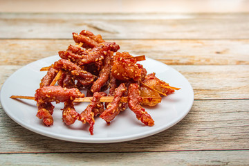 Fried sun dried pork style thai food.