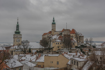 Naklejka na ściany i meble Winter landscape view on the snow cowere castle of Mikulov in Czech Republic