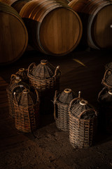 old barrels of wine in a cellar
