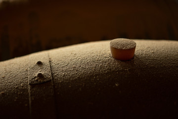 old barrels of wine in a cellar