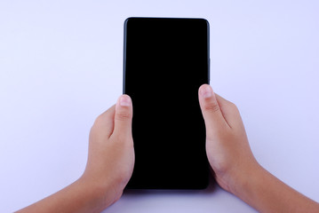 Hand holding a smartphone with blank screen