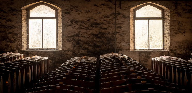 old barrels of wine in a cellar