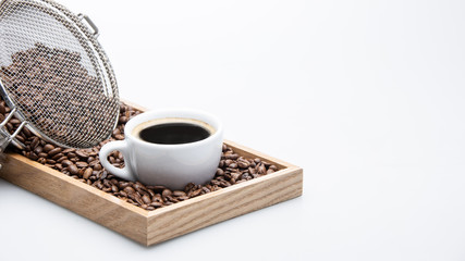 cup of coffee and beans on white background with text space