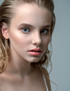 Perfectly retouched beauty photo of young beautiful girl. Wet hair and sensual look. 
