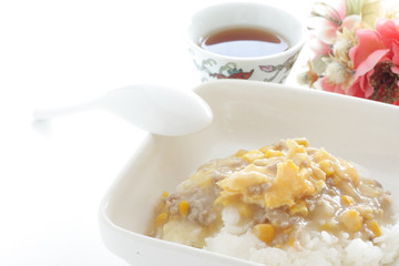 Chinese food, corn and pork mince simmered on rice 