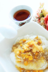 Chinese food, corn and pork mince simmered on rice 