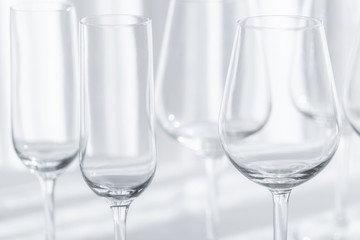 Several glasses for different kind of wine on the white tablecloth. Abstract  background.