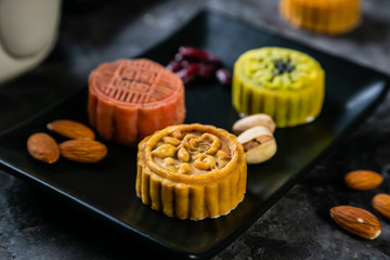 Mid Autumn Festival concept - yuebing monncakes on rustic background, copy space