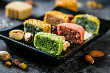 Mid Autumn Festival concept - yuebing monncakes on rustic background, copy space