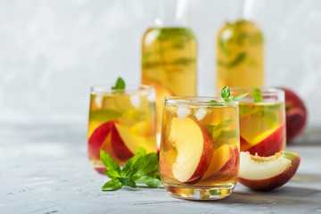 Summer cold tea with peaches and mint