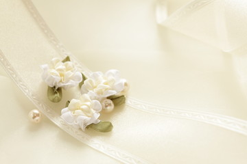 Obraz na płótnie Canvas Elegant ribbon and artificial flower for background image