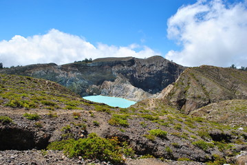 One of the turquoise green kelimutu lakes. Kelimutu consists of 3 lakes that change color. Sometimes, are blue, green, and black, and some other times they turn to white, red, and blue.