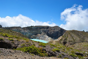 Fototapeta premium One of the turquoise green kelimutu lakes. Kelimutu consists of 3 lakes that change color. Sometimes, are blue, green, and black, and some other times they turn to white, red, and blue.